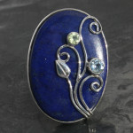 Designer lapis lazuli ring with blue topaz and peridot